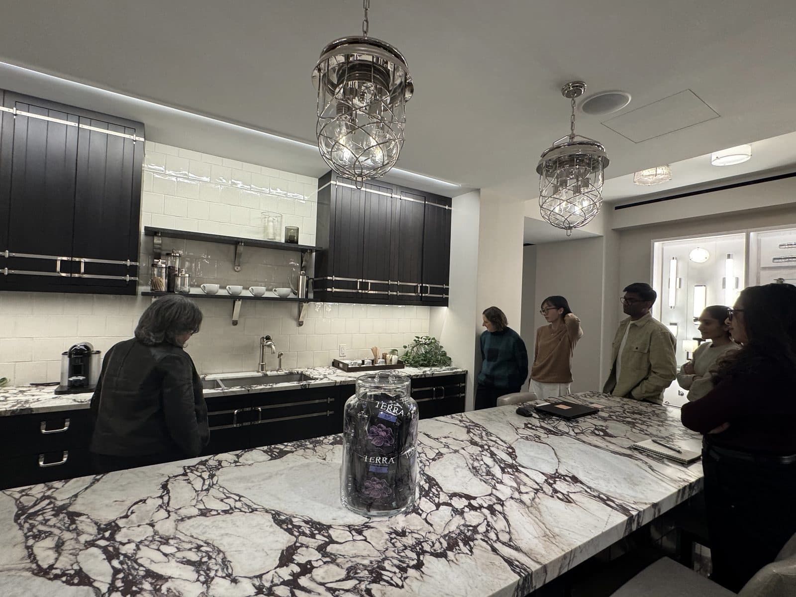 Field observation in a Waterworks showroom: staff and clients moving through the space on a working day
